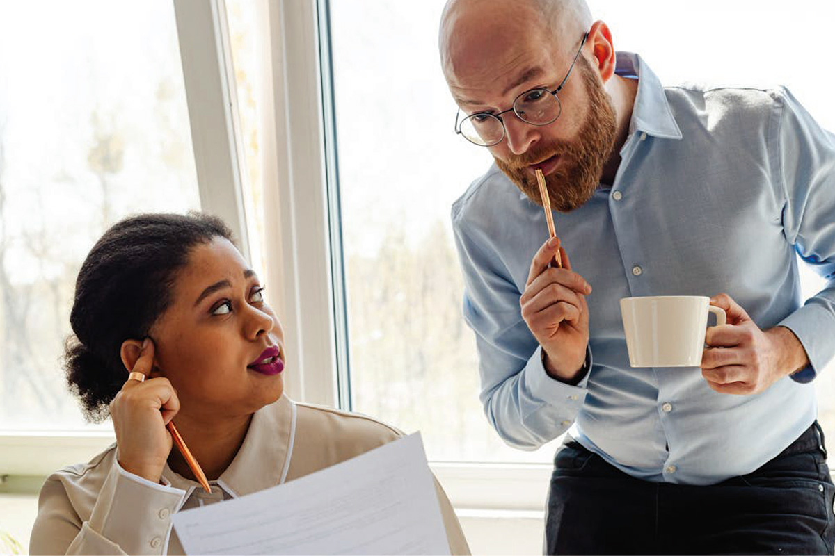 A man and woman discussing a business query