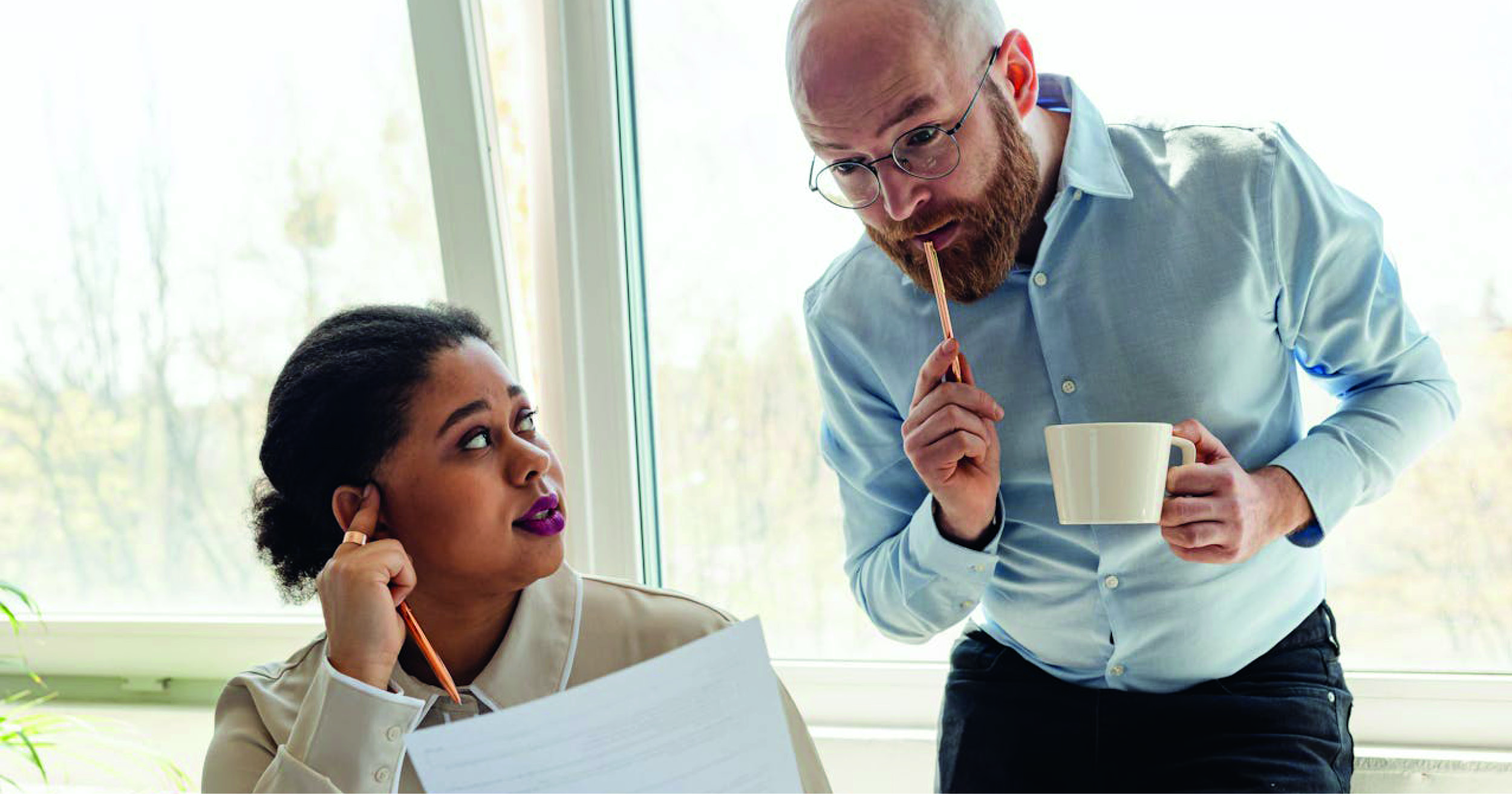 A man and woman discussing a business query